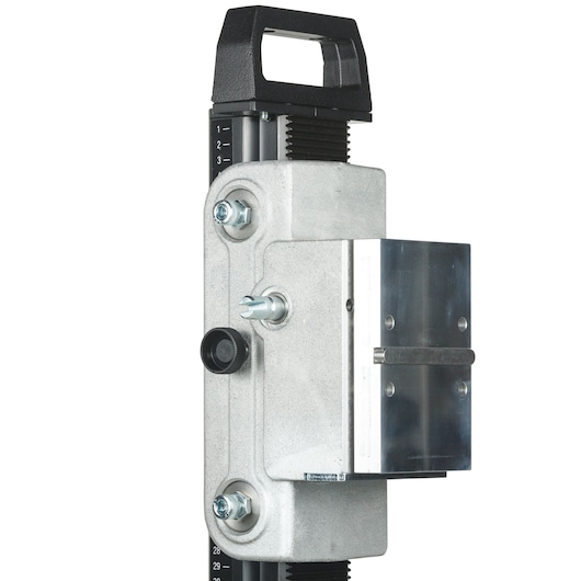 Close-up view of a DEWALT metal mounting bracket, featuring a black handle and adjustment markings. The bracket is used for precise placement in photography or drilling applications.