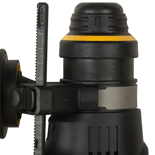 Close-up view of a DEWALT D25333K rotary hammer drill showing detail of the depth gauge and part of the tool's body in black and yellow color.