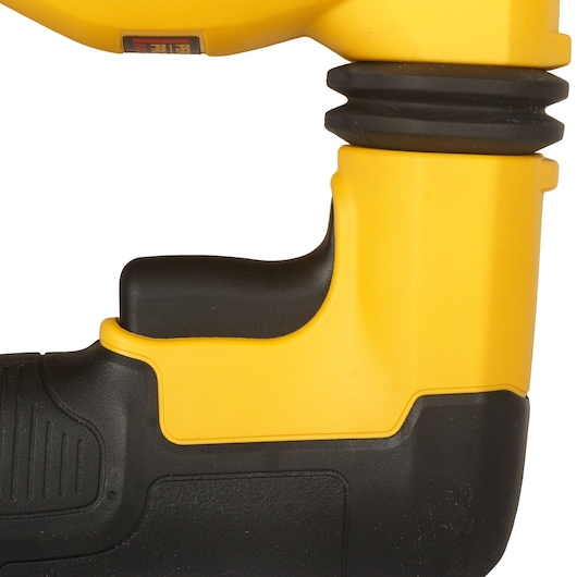 Close-up view of the handle and part of a yellow and black DEWALT power tool, showing the ergonomic design and textured grip.