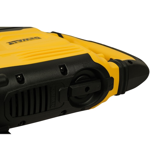 Close-up view of a DeWalt power tool, showing a yellow and black housing with visible DeWalt branding and part of the tool's adjustment mechanism.