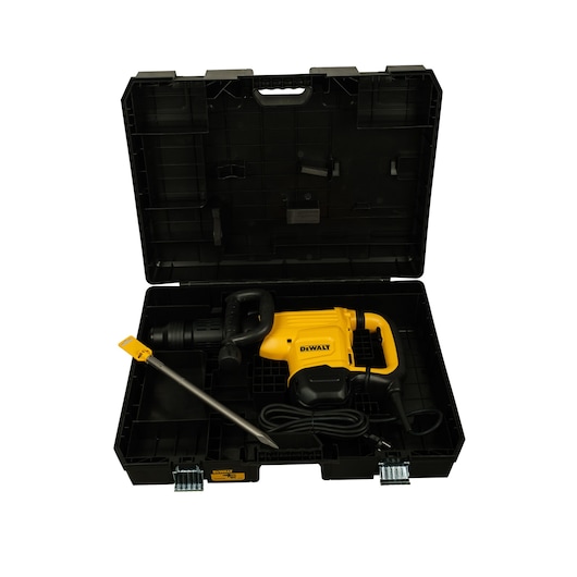 A yellow DEWALT power tool, likely a demolition hammer, placed inside an open black carrying case with a handle and latches. The case includes a long metal accessory and a power cord, organized in compartments.