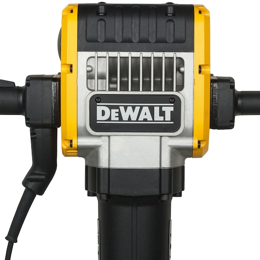 Close-up of a DEWALT electric demolition hammer, showing the front of the tool with the DEWALT logo, handles, and power cord.