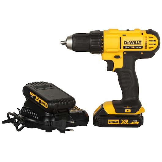 A yellow and black DEWALT 18V cordless drill with an XR battery, positioned beside its charging unit and power cord.