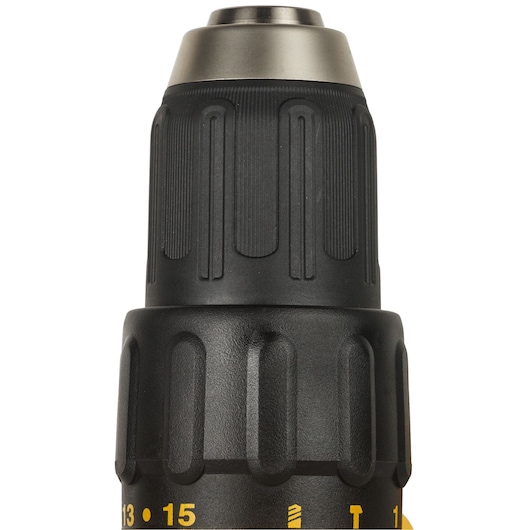 Close-up image of the chuck and front section of a DEWALT cordless drill, showing the textured grip and adjustment ring with numbers and symbols.