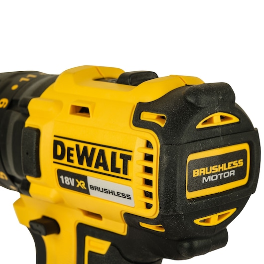 Close-up view of a Dewalt 18V XR brushless cordless power drill, showing the yellow and black casing, branding, and brushless motor label.