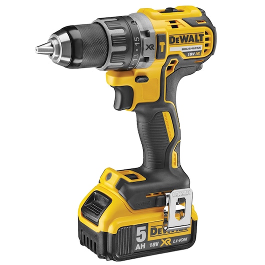 A DEWALT 18V XR brushless cordless drill with a 5Ah Li-ion battery. The drill is yellow and black, featuring a metal clip and various adjustment settings visible on the chuck.
