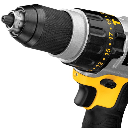 Close-up of a DEWALT cordless power drill, showing the adjustable torque settings, metal chuck, and part of the ergonomic handle with a yellow and black design.