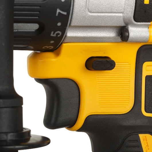 Close-up view of the handle and trigger area of a DeWalt cordless power drill, showing part of the grip, direction switch, and the yellow and black casing.