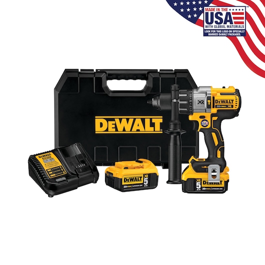 A DEWALT cordless drill kit including a black carrying case, a yellow and black cordless drill, two battery packs, a battery charger, and a side handle. The kit features the DEWALT logo and a label indicating it is made in the USA with global materials.