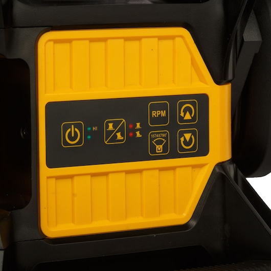 Close-up view of a yellow DEWALT power tool control panel with several buttons and icons. The panel displays a power button, speed indicator (HI), RPM, angular settings, and directional arrows.