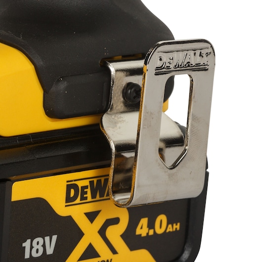 Close-up of a DEWALT cordless power tool with a metal belt clip attached. The tool features an 18V XR 4.0Ah lithium-ion battery.