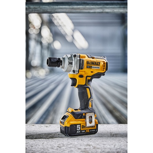 DEWALT DCF894N cordless impact wrench with 18V battery shown on an industrial surface.