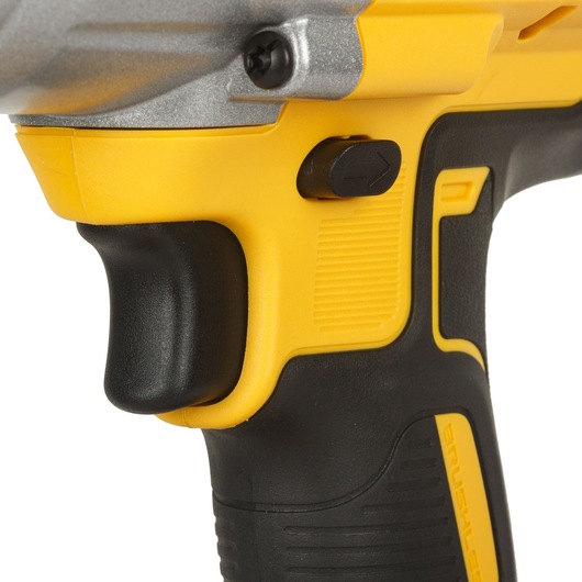 Close-up view of the handle and trigger area of a DEWALT cordless power tool, showcasing its yellow and black ergonomic design.