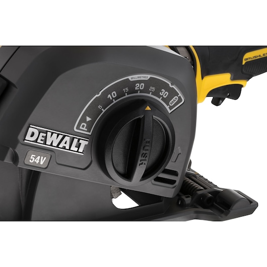 Close-up view of a DEWALT power tool showing a control dial, millimeter scale, and 54V marking. The tool features a yellow and black design.
