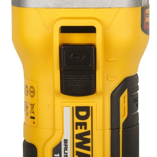 Close-up view of the DEWALT DCG405P2-QW power tool showing its yellow and black body with a black switch and safety labels.