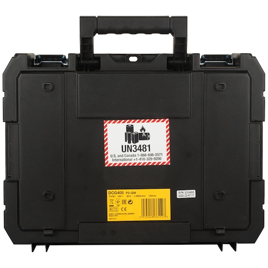 Black DEWALT hard carrying case with a handle, safety labels, and product information sticker on the front. The case features a UN3481 marking indicating lithium-ion batteries inside.