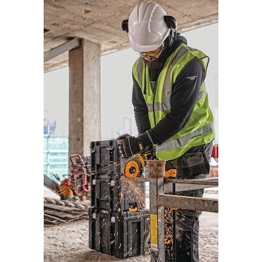 6 INCH CORDLESS GRINDER WITH KICKBACK BRAKE being used by a workman on a work site