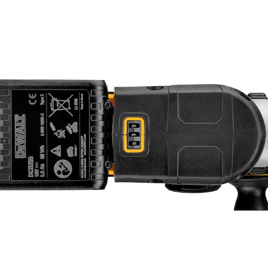 Close-up image of a DEWALT DCH273P2 power tool, showing the battery pack and control buttons. The battery label includes specifications and safety icons.