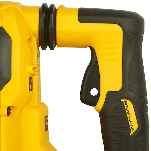 Close-up of the handle and upper body of a yellow and black DEWALT brushless power tool.