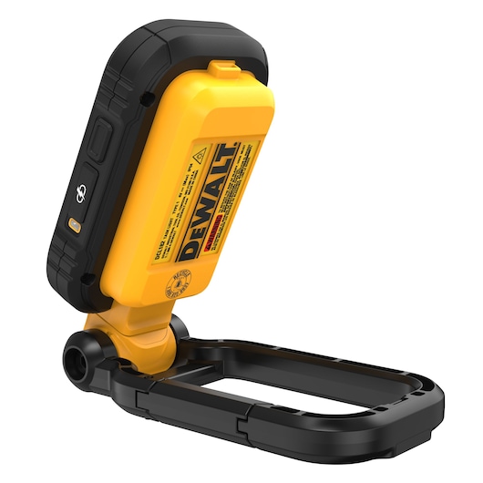 A portable DEWALT branded yellow and black LED work light with a foldable stand, model DCL182-KR, photographed against a white background.