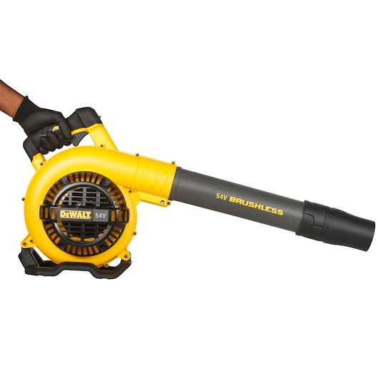 A yellow and black DEWALT 54V brushless cordless leaf blower being held by a gloved hand, shown against a white background.