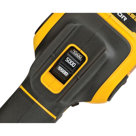 Close-up of a DEWALT power tool showing a speed control switch with settings labeled 4500, 5000, and 5500. The tool is yellow and black.