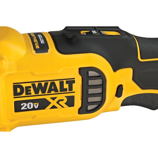 Close-up view of a DEWALT 20V XR brushless motor power tool, showing the brand label and part of the tool's yellow and black casing.