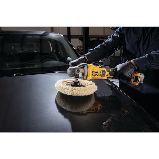 close up of XR cordless variable speed rotary polisher being used to polish a car