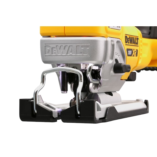 Close-up image of a DEWALT cordless jigsaw, model DCS334N, showing the front metal guard, blade, and part of the yellow and silver body.