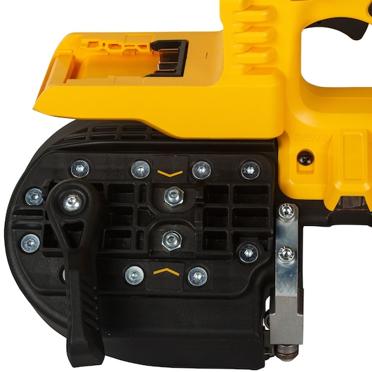 Close-up view of a DEWALT cordless band saw, showing the black and yellow casing, screws, and handle details.