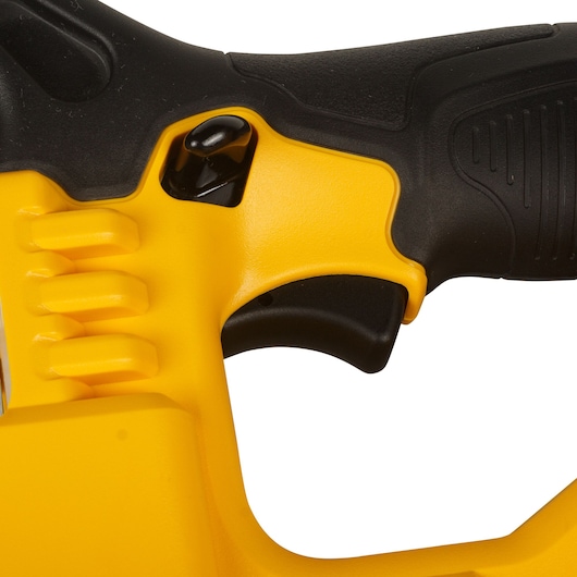Close-up of a DEWALT power tool handle showing a yellow and black ergonomic grip and trigger.