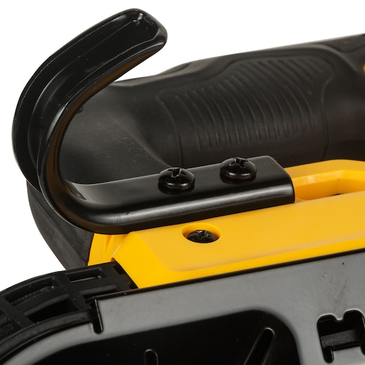 Close-up view of a DEWALT power tool showing a black metal hook attached to a yellow and black body with screws.
