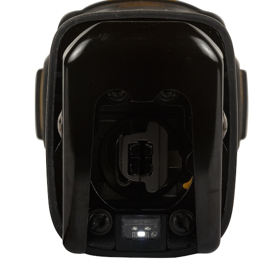 Close-up view of the front of a DEWALT cordless power tool, showing the battery compartment and LED indicator light.