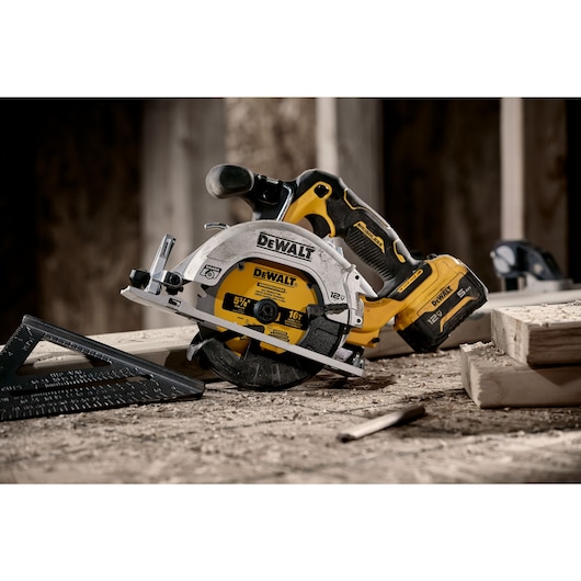 Xtreme 12 volt 5 and three eighths inch brushless cordless circular saw tool being used at a construction site.