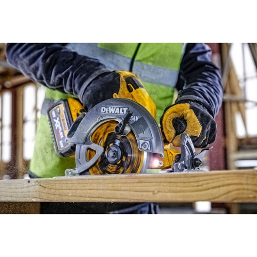 DEWALT saw in use. SKUs DCZ507T2-XE, DCS578N, DCZ503X2-XE. Photography product in construction setting.
