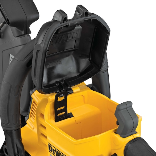 Close-up view of the open battery compartment of a DEWALT power tool, showing internal details of the yellow and black housing.