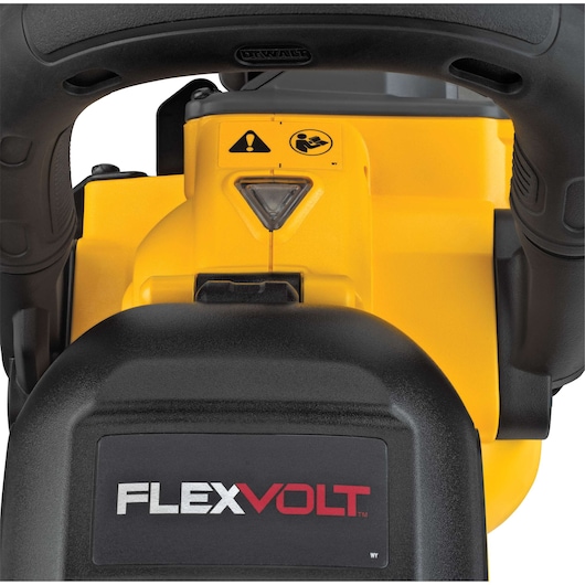 Close-up view of a DEWALT FLEXVOLT power tool, showing the handle, warning labels, and the FLEXVOLT branding on a black surface.