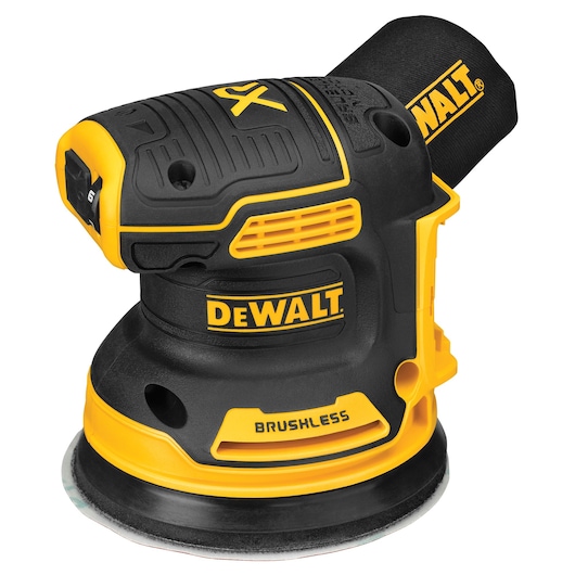 A DEWALT brand brushless cordless random orbital sander in black and yellow, designed for smoothing surfaces. The tool features a dust collection bag attached at the rear.