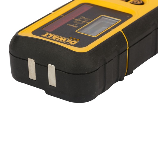 Close-up view of a Dewalt DE0892 laser detector, featuring a black and yellow rugged casing and metal contact points. The device is used for detecting and measuring laser signals in construction and photography applications.