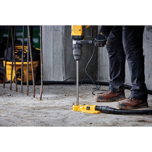 DEWALT drill in use on concrete. Photography category. SKUs: DT60814, DT60814-QZ.