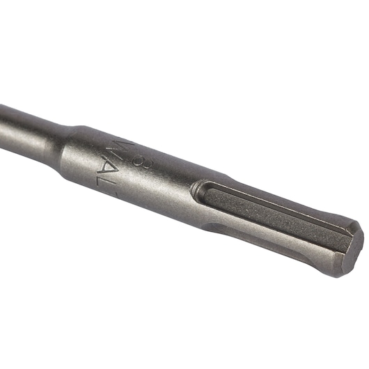 Close-up view of a DEWALT SDS drill bit with a metallic finish, showing detailed grooves and branding.