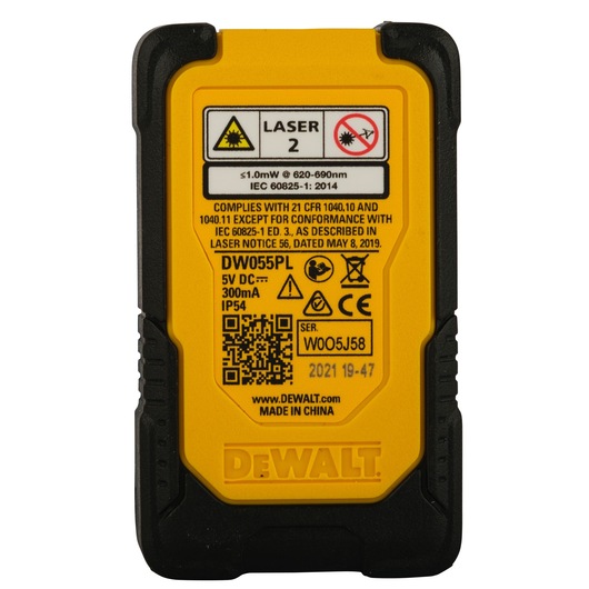 Back view of a DEWALT DW055PL laser measuring tool, showing warning labels, technical specifications, QR code, and serial number on a yellow and black casing.