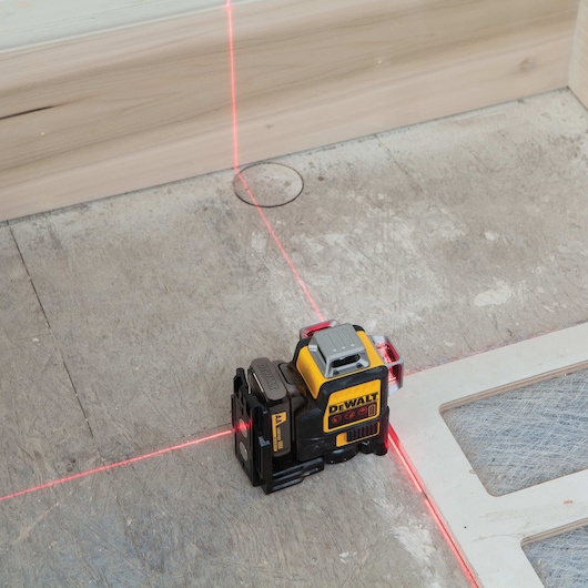 Compatible red 3 by 360 line laser being used at a construction site.