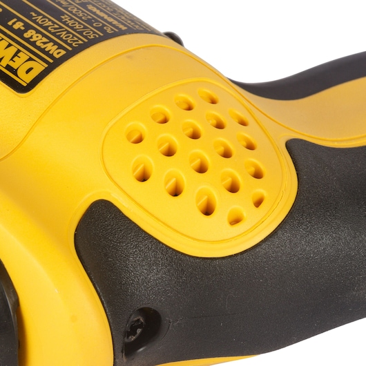 Close-up image of a DEWALT DW268 electric tool handle, showing yellow and black plastic housing with ventilation holes.