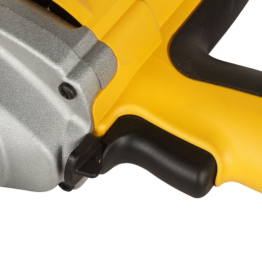 Close-up view of the handle and trigger area of a DEWALT power tool, featuring yellow and black components with a metallic section.