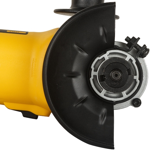 Photo of DEWALT DW802 angle grinder close-up, yellow body and black guard, side angle, power tool category.