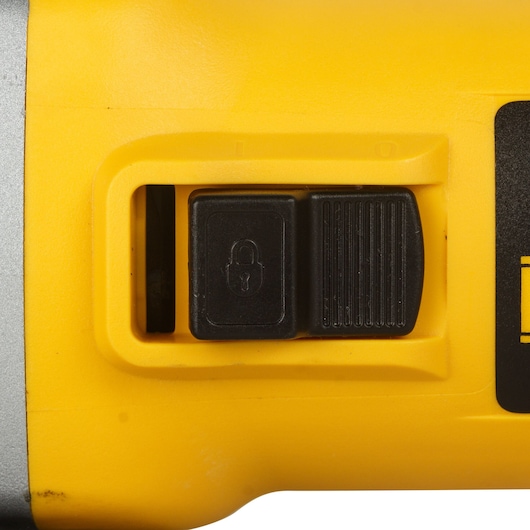 Photo of DEWALT DW802 safety switch feature, yellow casing, close-up detail, product photography.