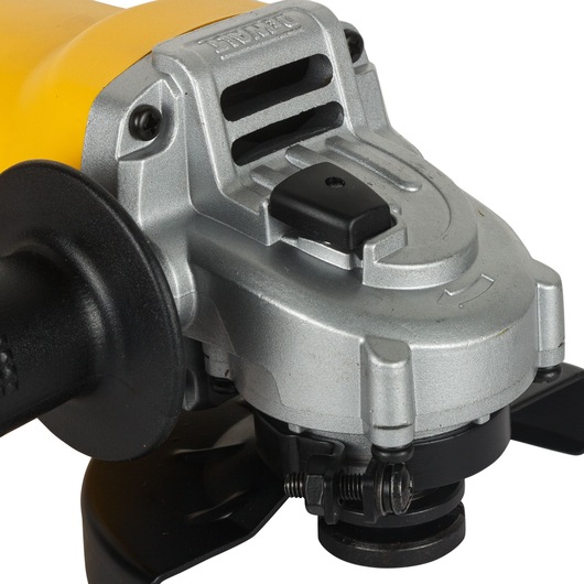 Close-up view of a DEWALT DW803 angle grinder. The product features a metallic silver body with black and yellow accents, and visible control switches and attachments.
