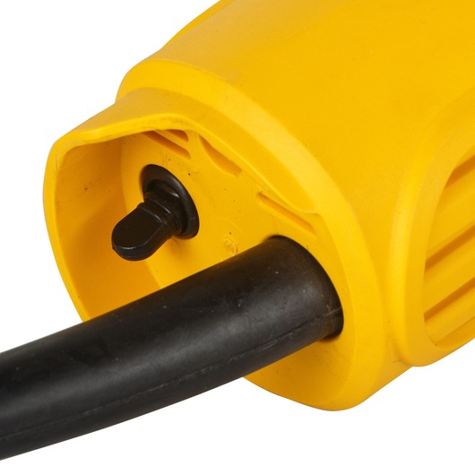 Close-up image of the power cord connection and switch area on a yellow DEWALT DW803 electric tool, showing the black cable securely attached to the tool housing.