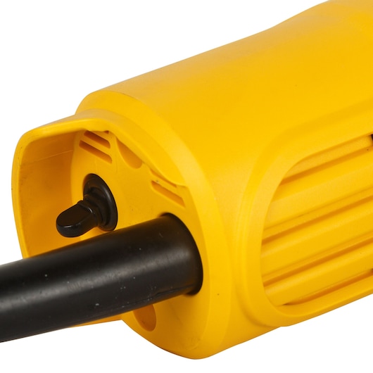 Close-up image of a yellow DEWALT DW810 power tool, showing the handle and a black switch.